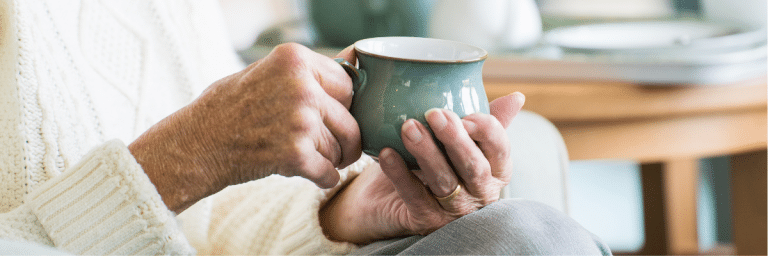 Hands holding tea - Country Lodge Nursing Home Worthing