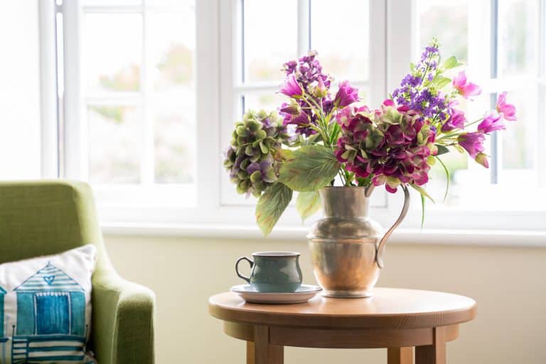 seasonal flowers on table by the window.